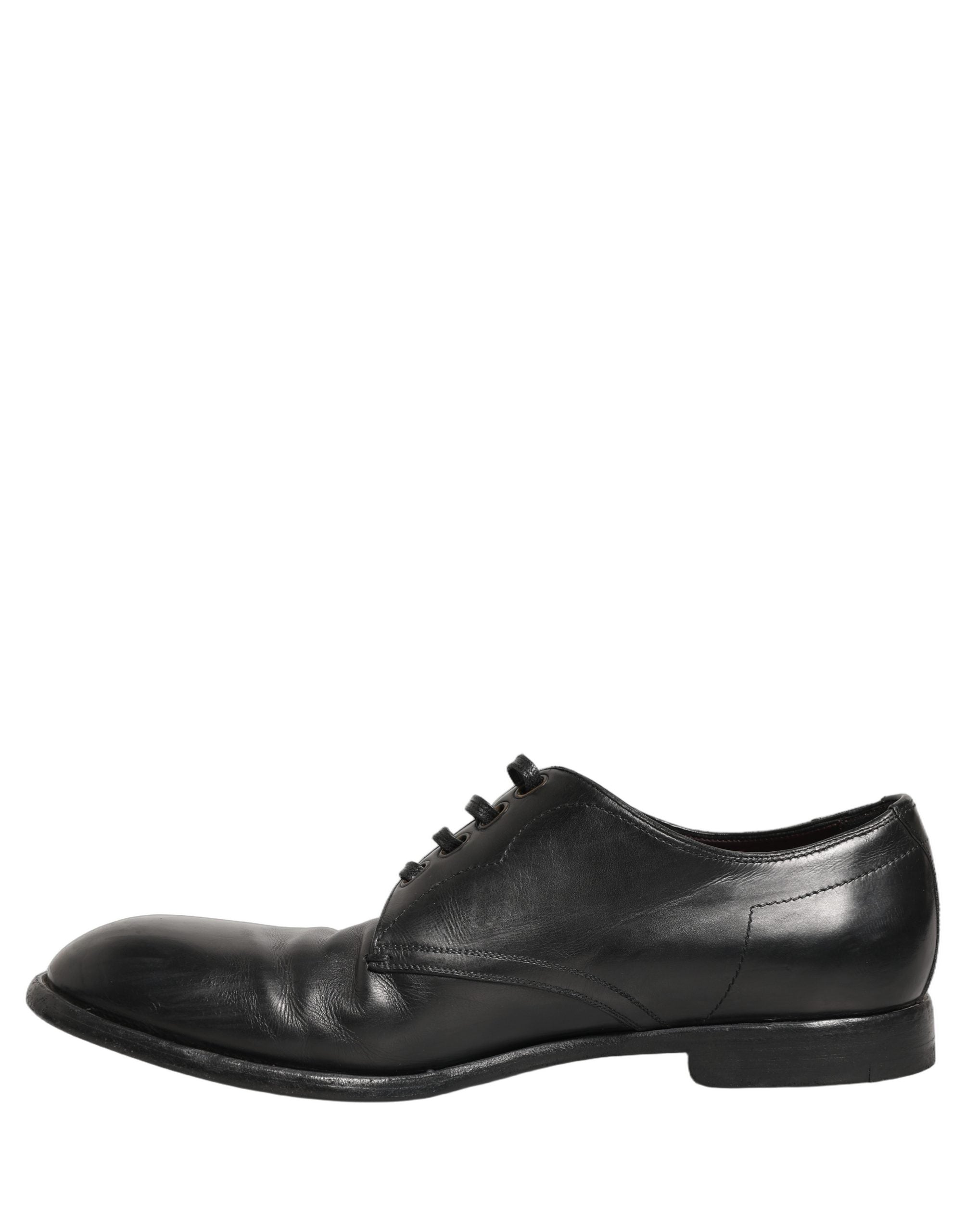 Chaussures derby formelles en cuir noir Dolce & Gabbana pour homme, style élégant et sophistiqué, vue de face.