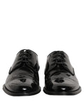 Chaussures Derby en cuir noir pour homme de la marque Dolce & Gabbana, chaussures formelles élégantes et sophistiquées.