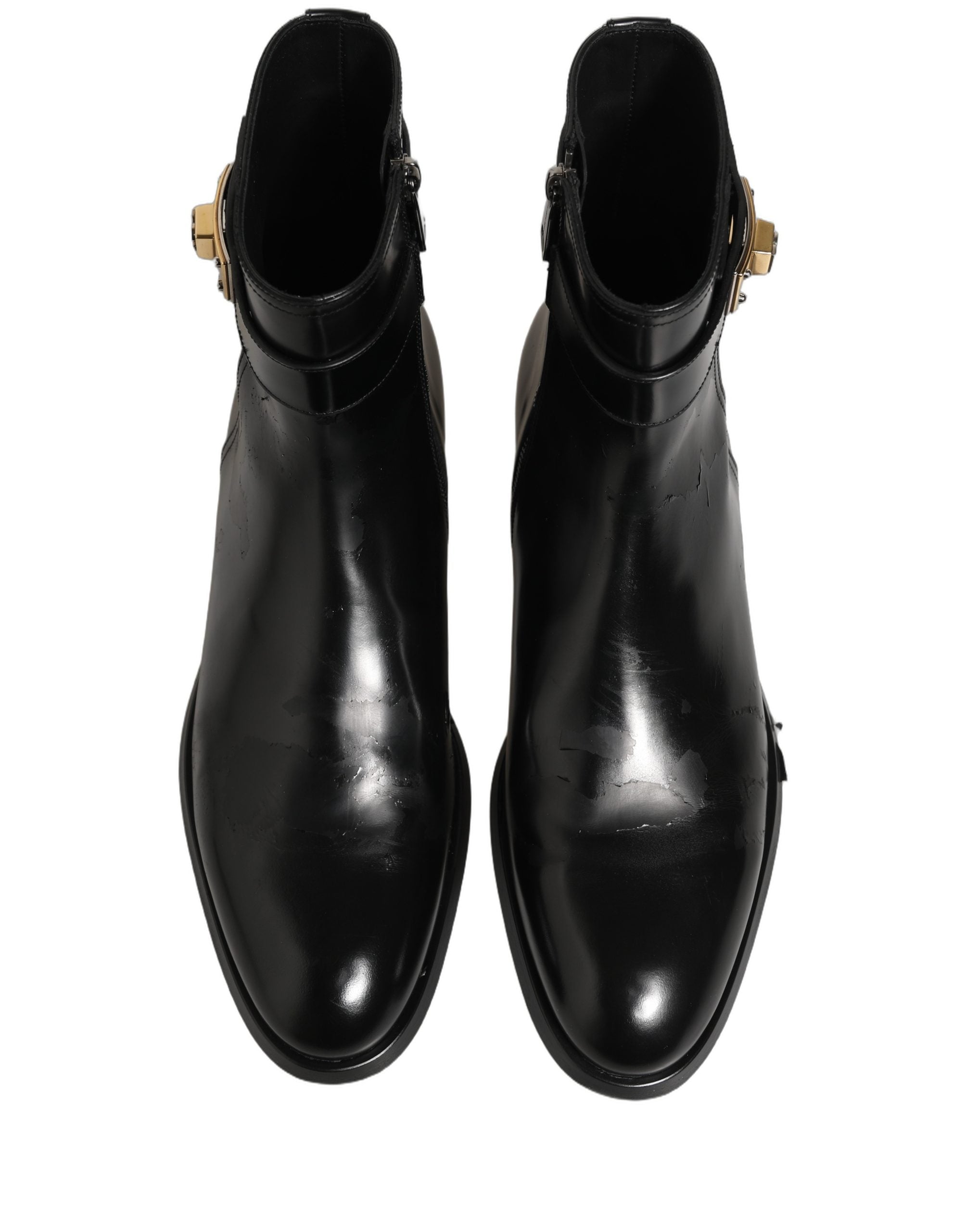 Bottes en cuir noir Dolce & Gabbana avec boucle à logo, mi-mollet, chaussures élégantes et modernes.