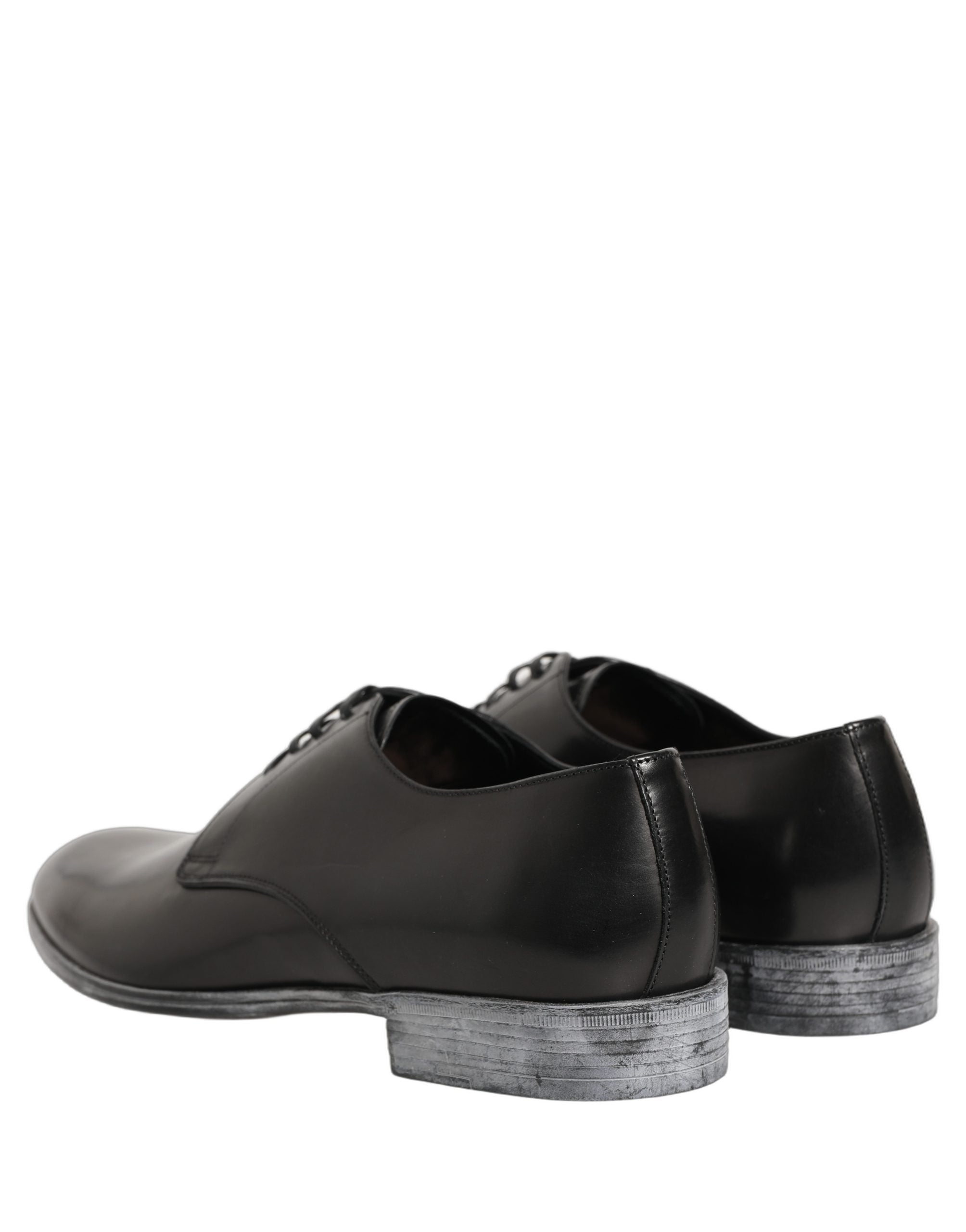 Chaussures Derby pour homme Dolce & Gabbana en cuir noir avec lacets, style élégant et sophistiqué.