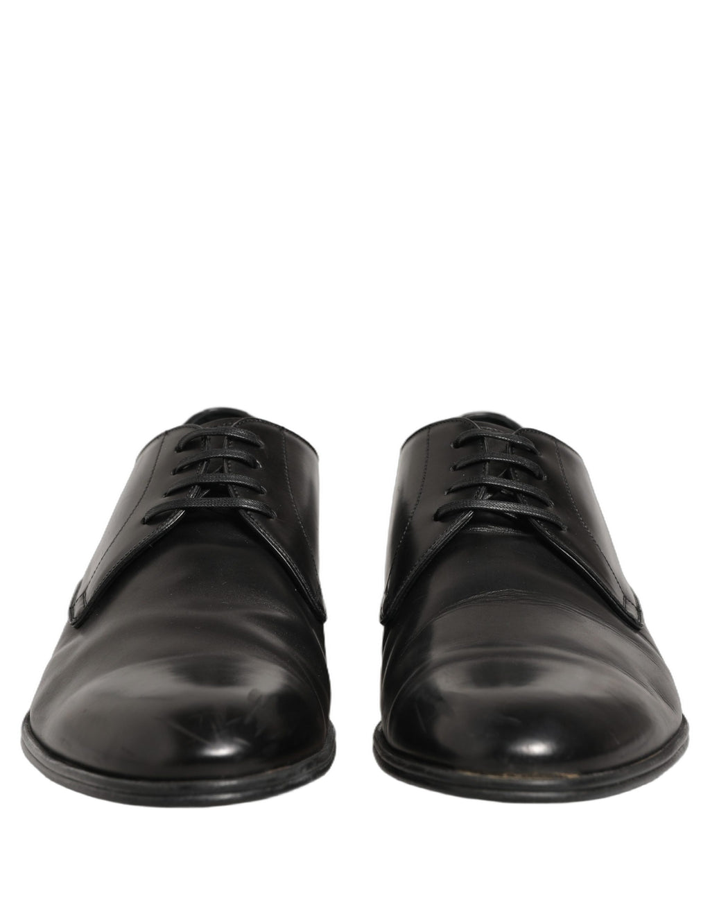 Chaussures derby noires en cuir et lacets de Dolce & Gabbana, élégantes et sophistiquées, vues de face.