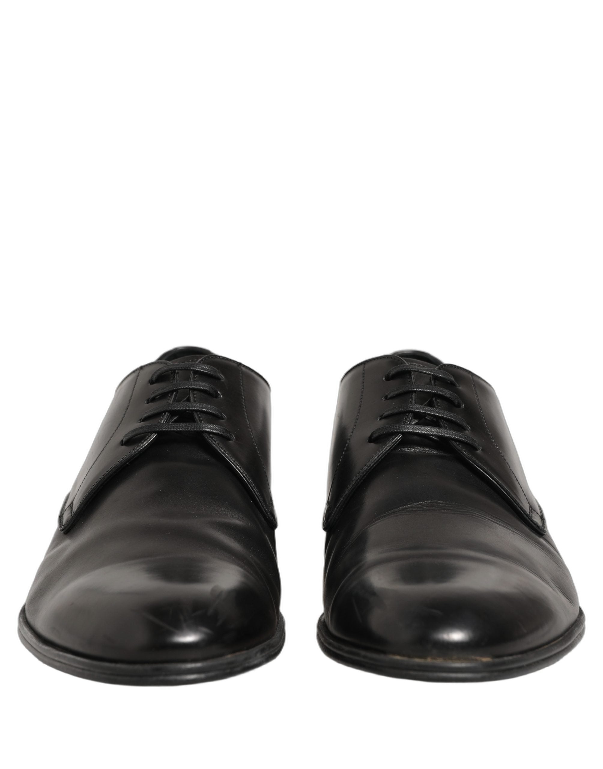Chaussures derby noires en cuir et lacets de Dolce & Gabbana, élégantes et sophistiquées, vues de face.
