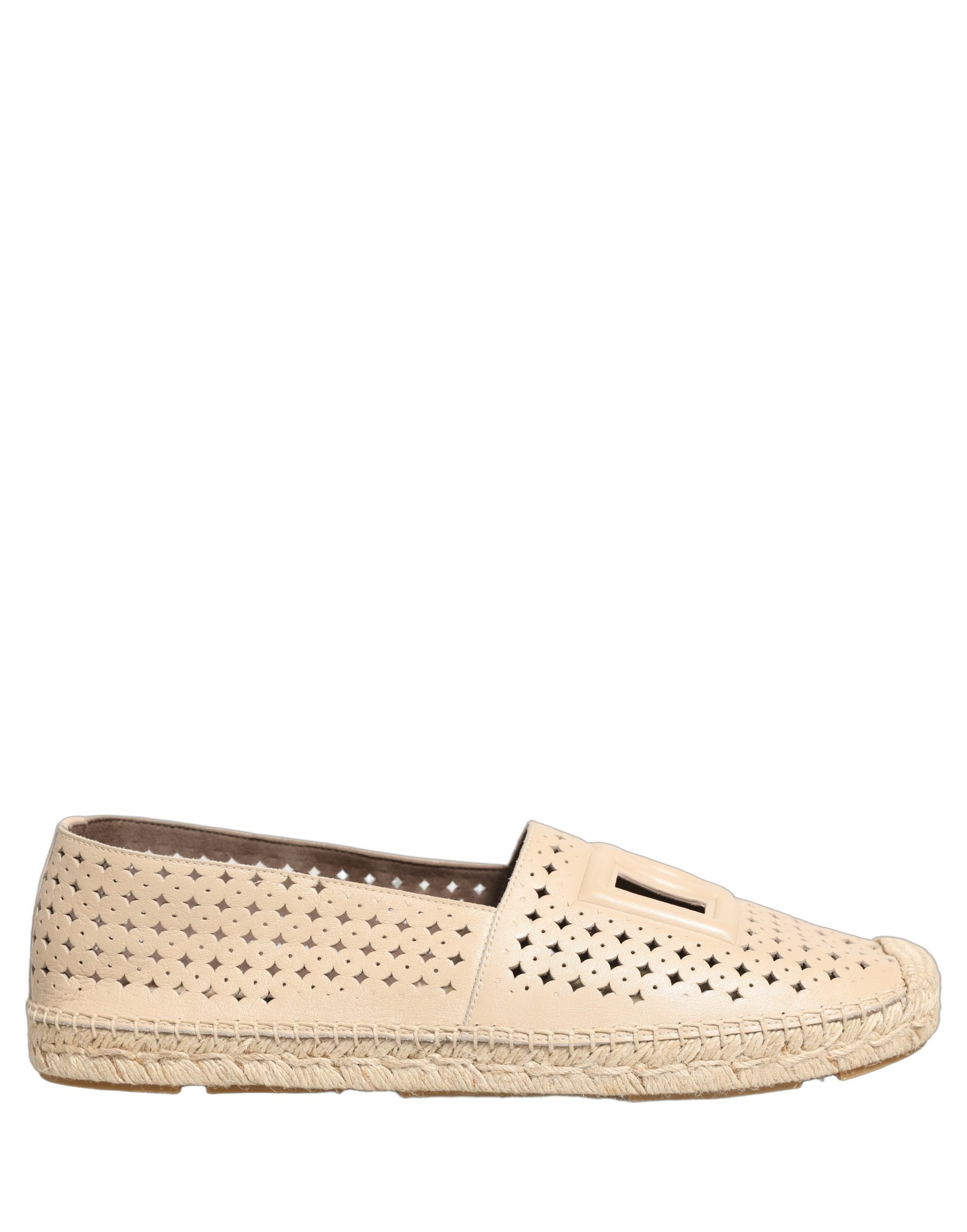 Espadrilles en cuir beige Dolce & Gabbana avec découpe logo et semelle en corde, vue de face.