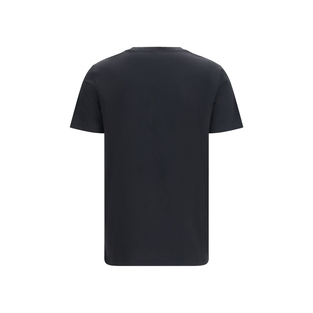 T-shirt en coton noir Balmain, coupe classique avec logo brodé, porté par un mannequin sur fond neutre.