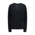 Sweat-shirt noir en laine Balmain Oves Aries avec logo brodé, porté sur mannequin, détails de couture visibles.