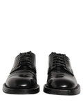 Chaussures Derby pour homme Dolce & Gabbana en cuir noir avec lacets, élégantes et sophistiquées.