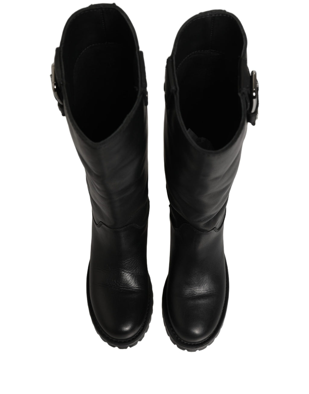 Bottes en cuir noir Dolce & Gabbana avec boucle, mi-mollet, style élégant et sophistiqué, visibles en détail dans l'image.