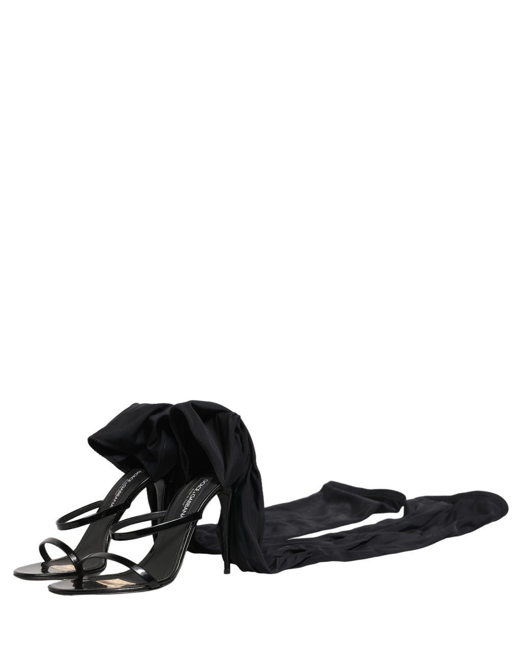 Sandales stilettos Dolce & Gabbana avec chaussettes, bottes hautes en noir, vue partielle sur le modèle.