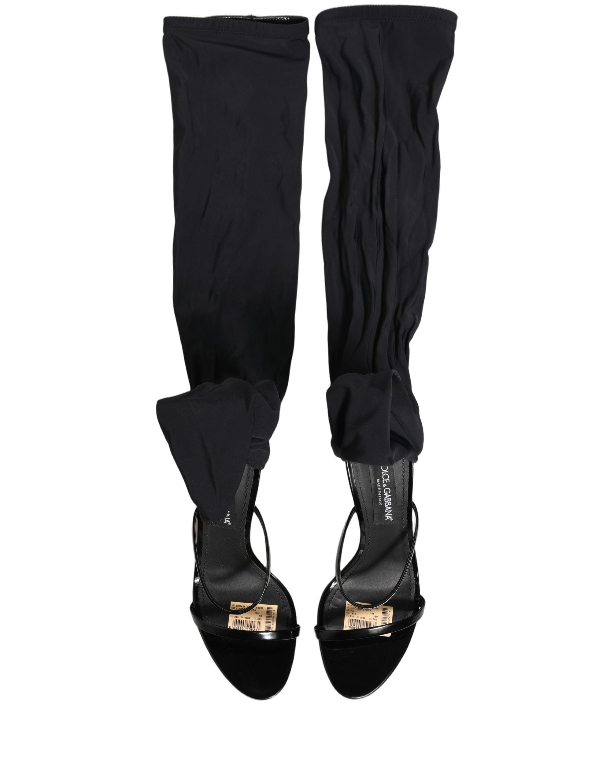 Chaussures Dolce & Gabbana, sandales stilettos, chaussettes et bottes hautes noires, mode élégante et sophistiquée.