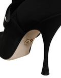 Chaussures à talons stilettos noires Dolce & Gabbana, bottines mi-mollet élégantes en cuir pour femmes.