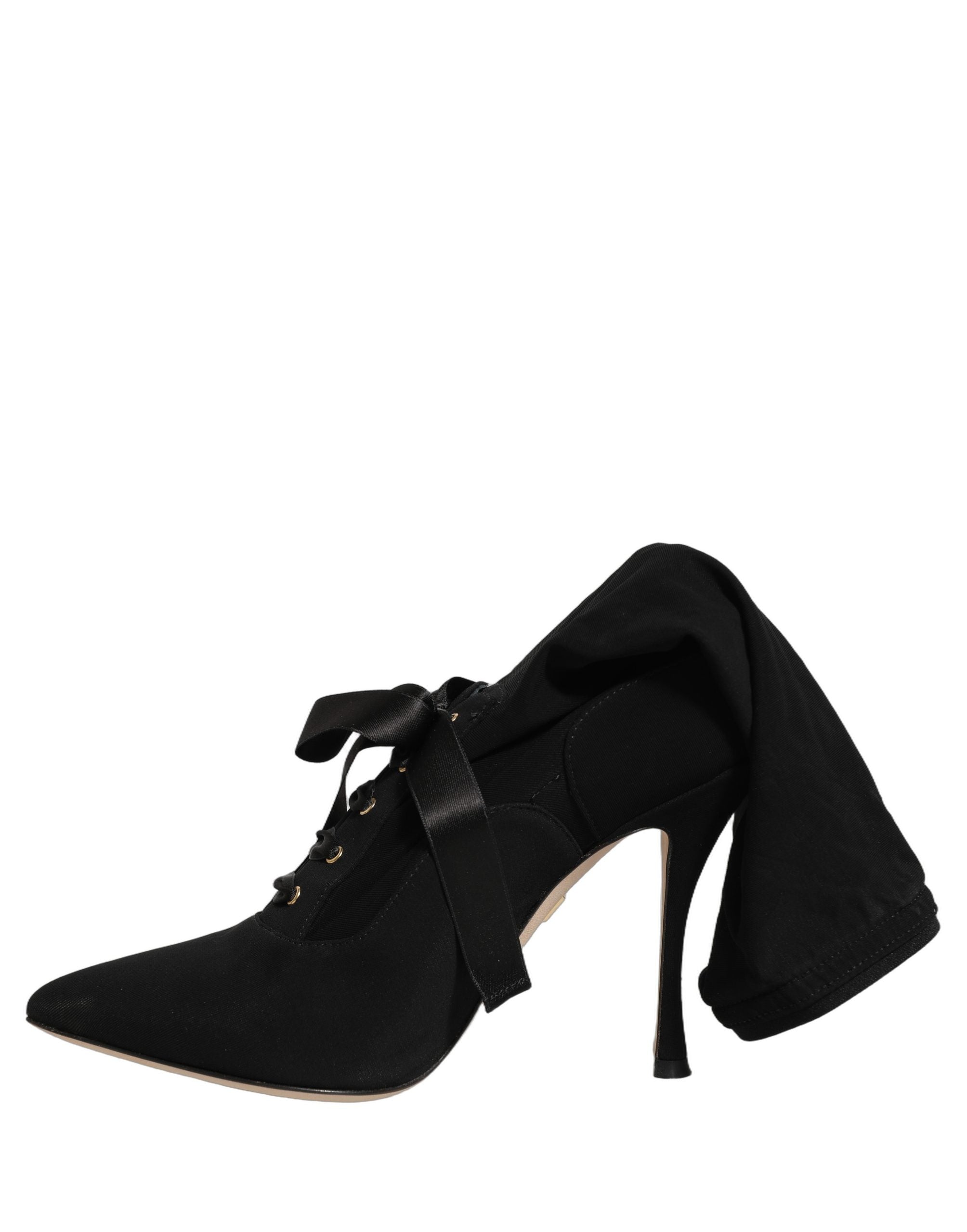Chaussures Dolce & Gabbana, bottines noires à talons stilettos, mi-mollet, élégantes et sophistiquées.