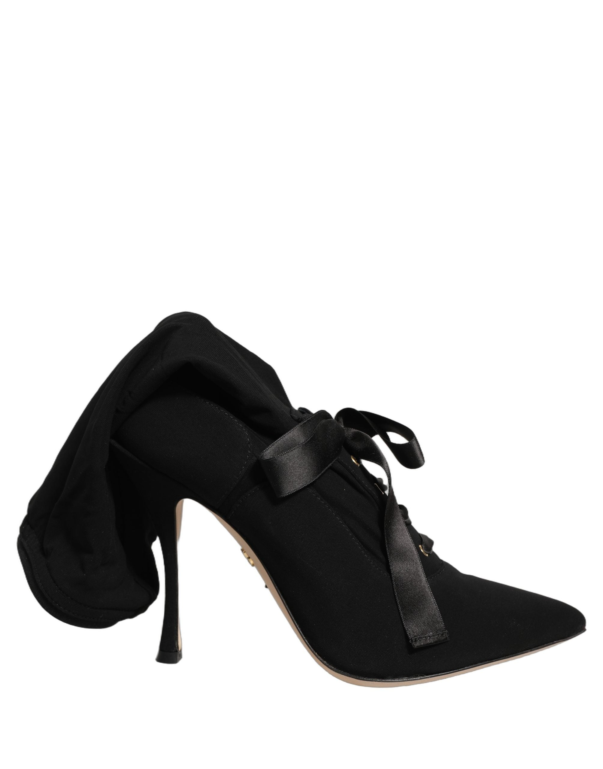 Chaussures Dolce & Gabbana bottines en cuir noir avec talons aiguilles et hauteur mi-mollet, style élégant et sophistiqué.