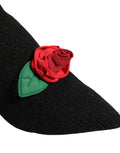 Chaussures Dolce & Gabbana, bottines noires à talons aiguilles et mi-mollet, style élégant et sophistiqué.