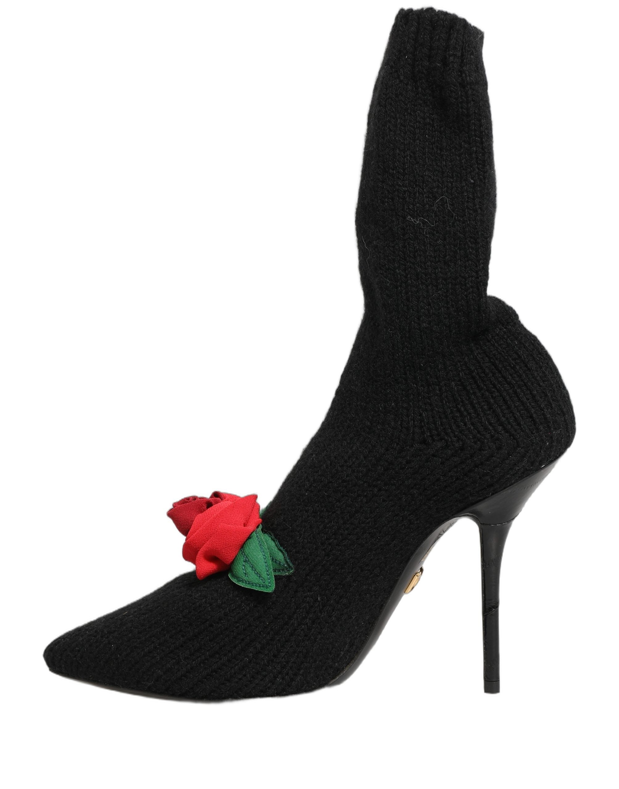 Chaussures Dolce & Gabbana talons stilettos noirs, bottines mi-mollet en cuir avec talons hauts élégants et design sophistiqué.