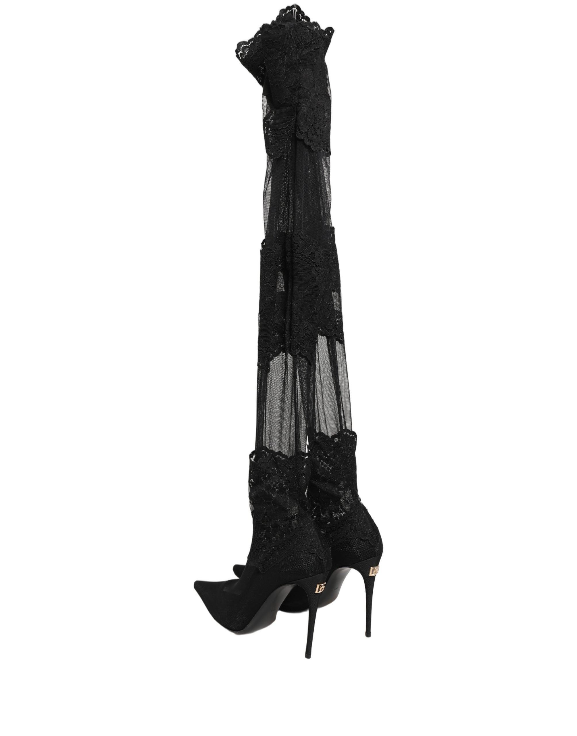 Bottes Dolce & Gabbana noires, mi-mollet, en matière élégante avec semelle solide, chaussures de mode sophistiquées.