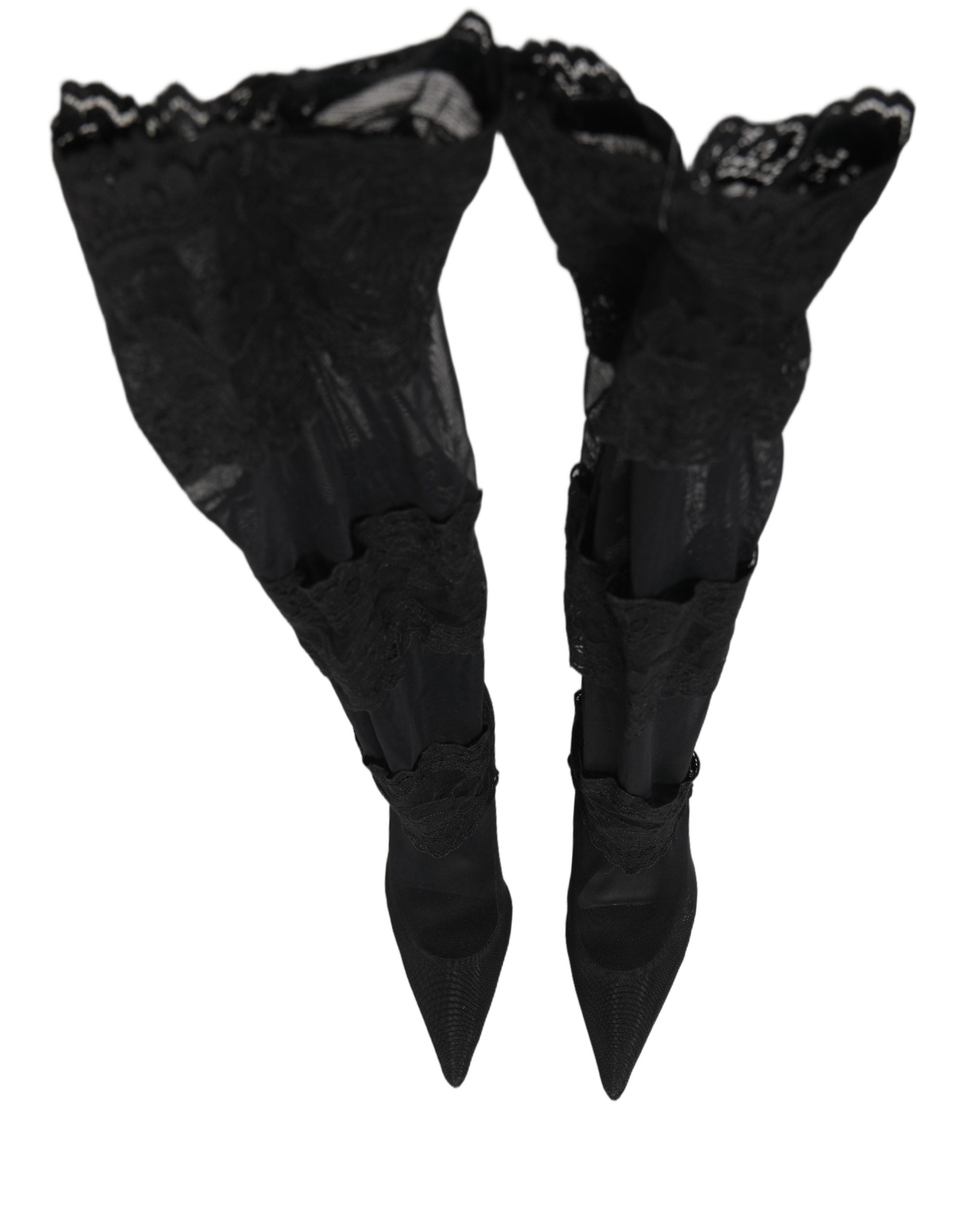 Botines noirs Dolce & Gabbana avec chaussettes hautes, talons et design élégant, visibles sur l'image.