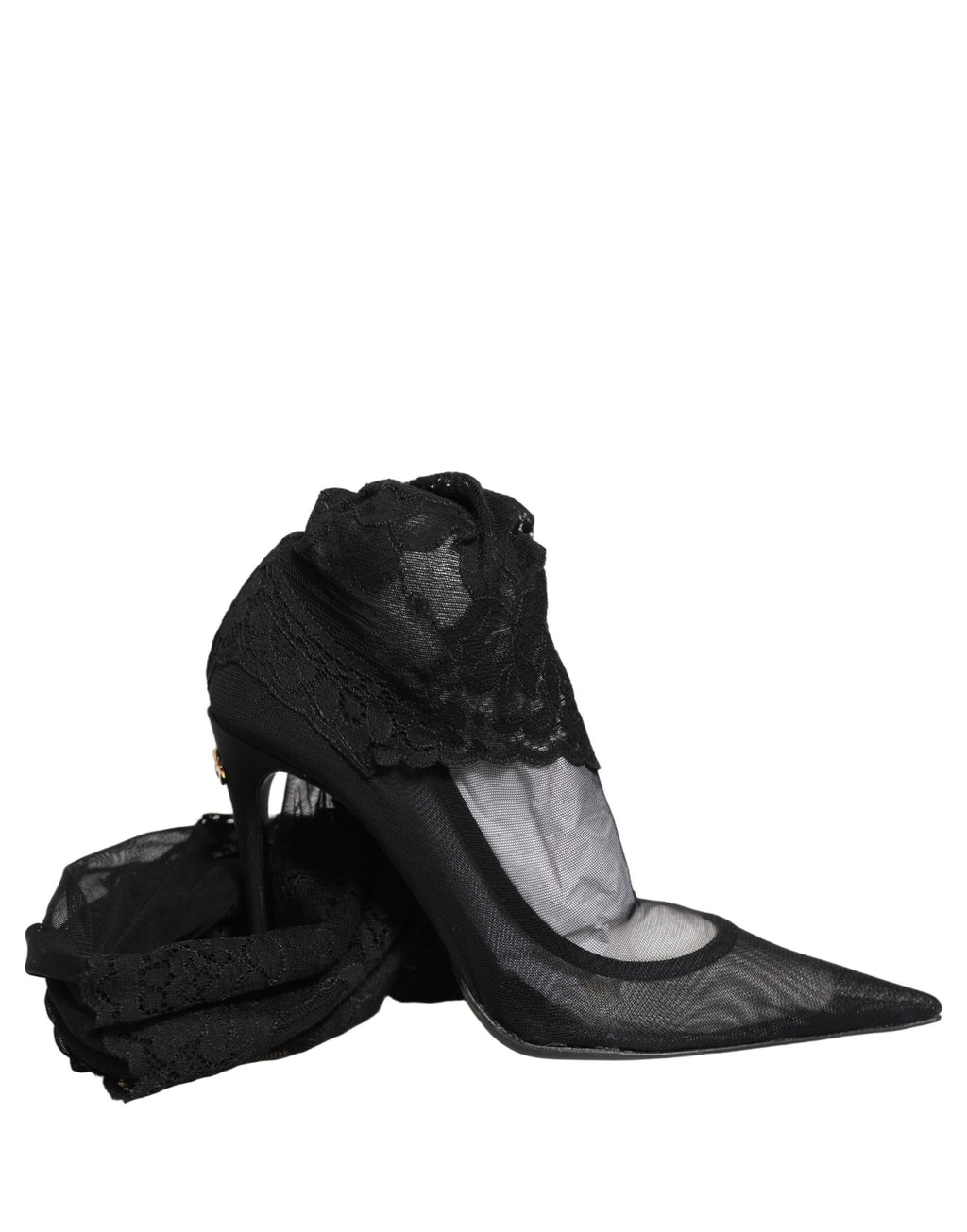 Bottes Dolce & Gabbana noires, cuissardes, avec semelle élégante et design sophistiqué, visibles en gros plan.