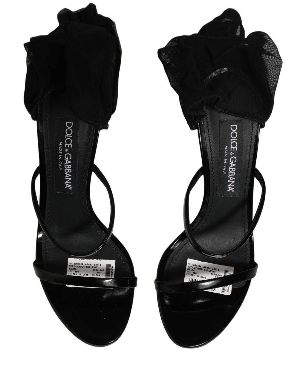 Sandales stilettos Dolce & Gabbana avec chaussettes, bottes hautes en cuir noir, mode élégante et sophistiquée.