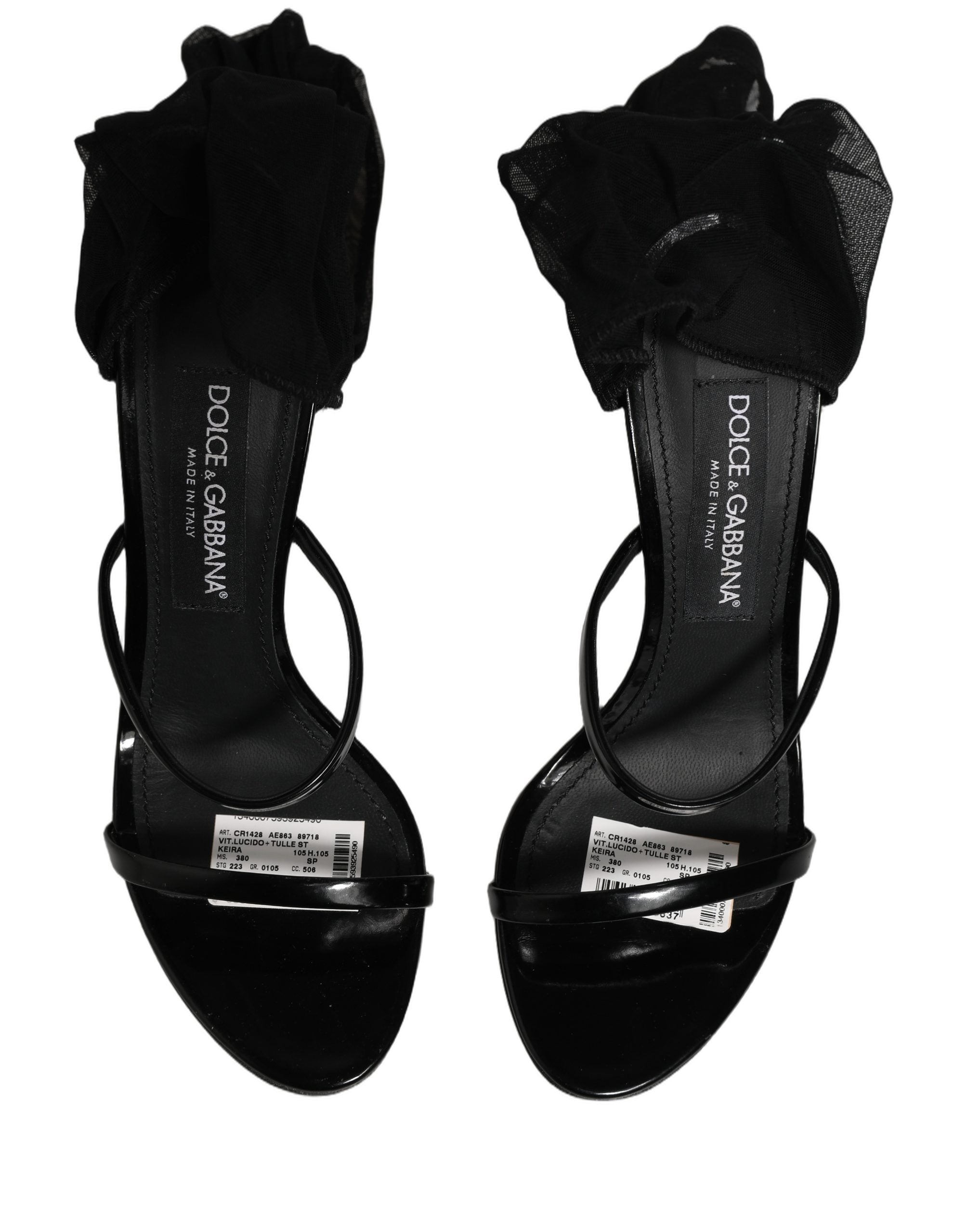 Sandales stilettos Dolce & Gabbana avec chaussettes, bottes hautes en cuir noir, mode élégante et sophistiquée.