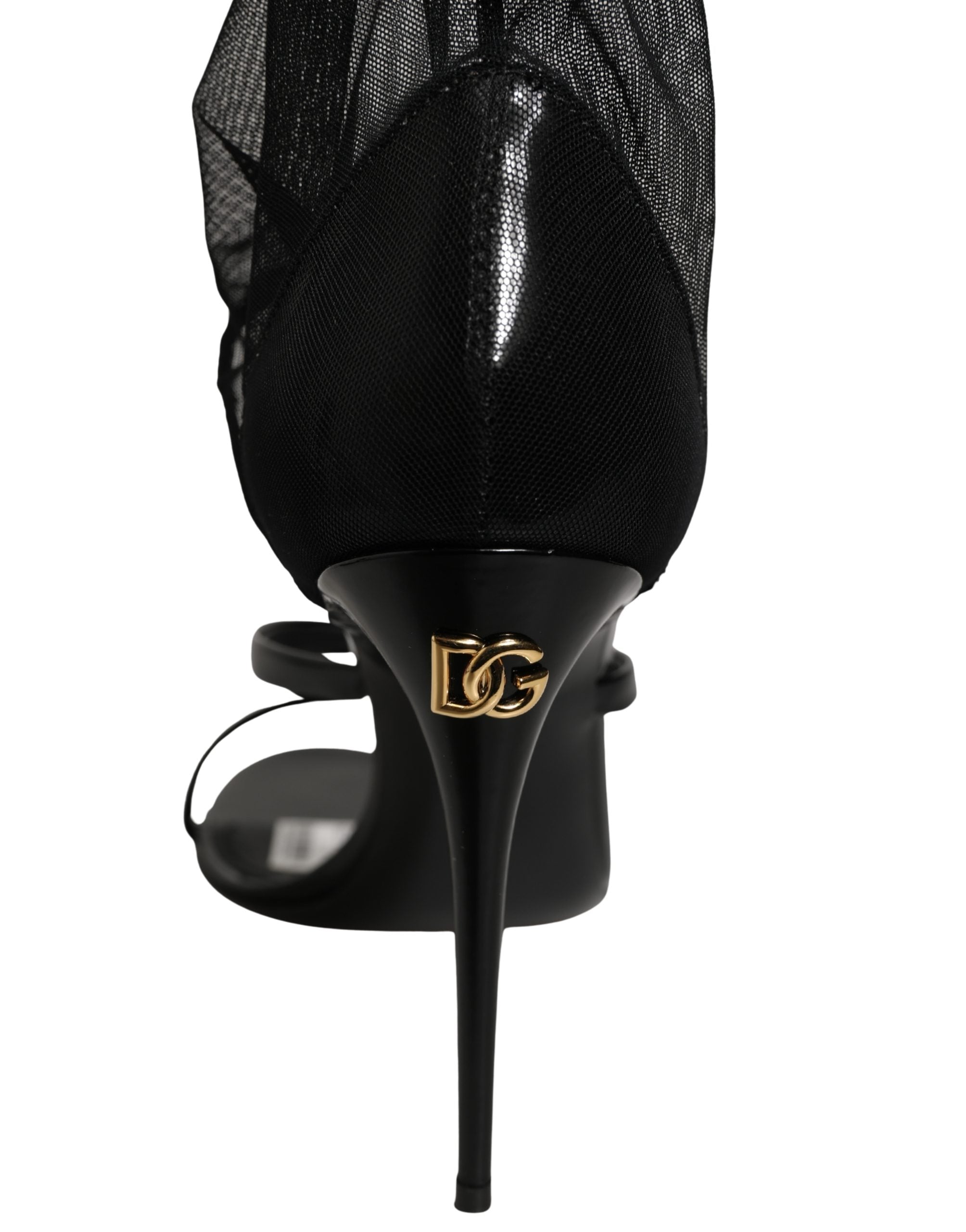 Sandales stilettos Dolce & Gabbana avec chaussettes, bottes hautes en noir, détail élégant et sophistiqué.