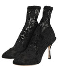 Chaussettes noires Dolce & Gabbana avec détails en dentelle, associées à des bottines élégantes Taormina.