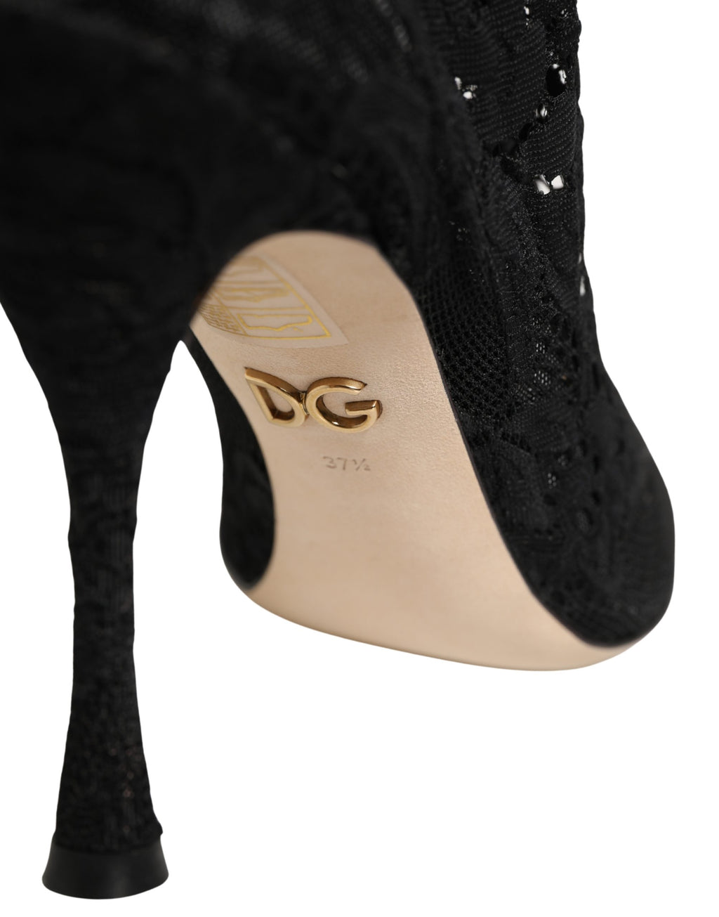 Chaussettes noires Dolce & Gabbana avec motifs en dentelle, portées avec des bottines élégantes Taormina Lace Pumps.