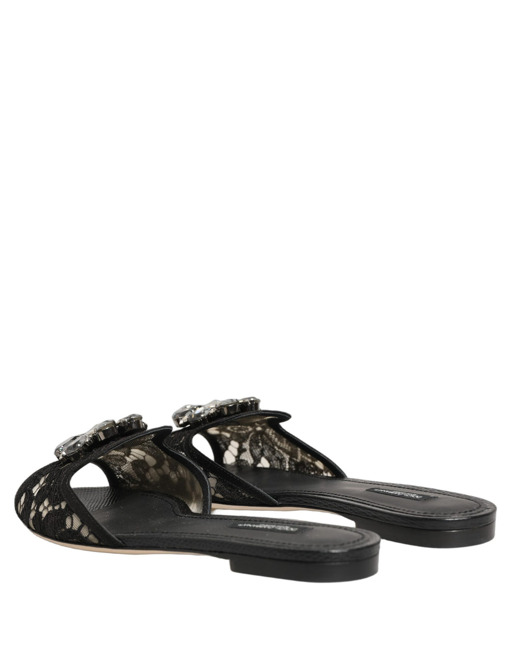 Chaussures plates noires Dolce & Gabbana Devotion en dentelle, slip-on élégantes avec détails en dentelle fine et finition sophistiquée.