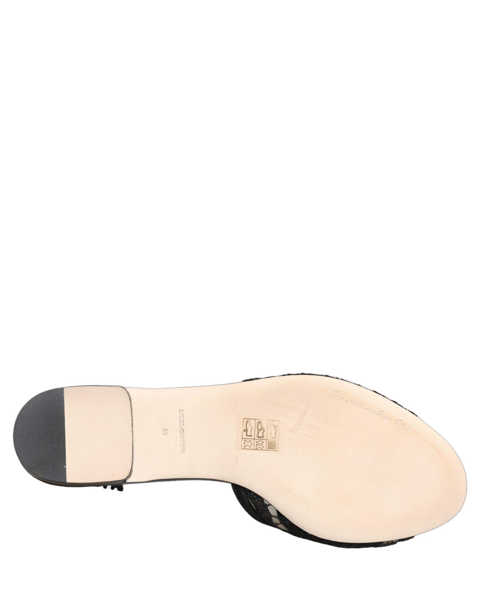 Chaussures plates Dolce & Gabbana Devotion en dentelle noire, slip-on élégantes et confortables pour femme.