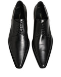 Chaussures derby en cuir noir Dolce & Gabbana avec lacets, élégantes et sophistiquées, vue de face.