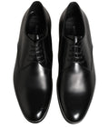 Chaussures derby en cuir noir Dolce & Gabbana avec lacets, élégantes et classiques pour homme.