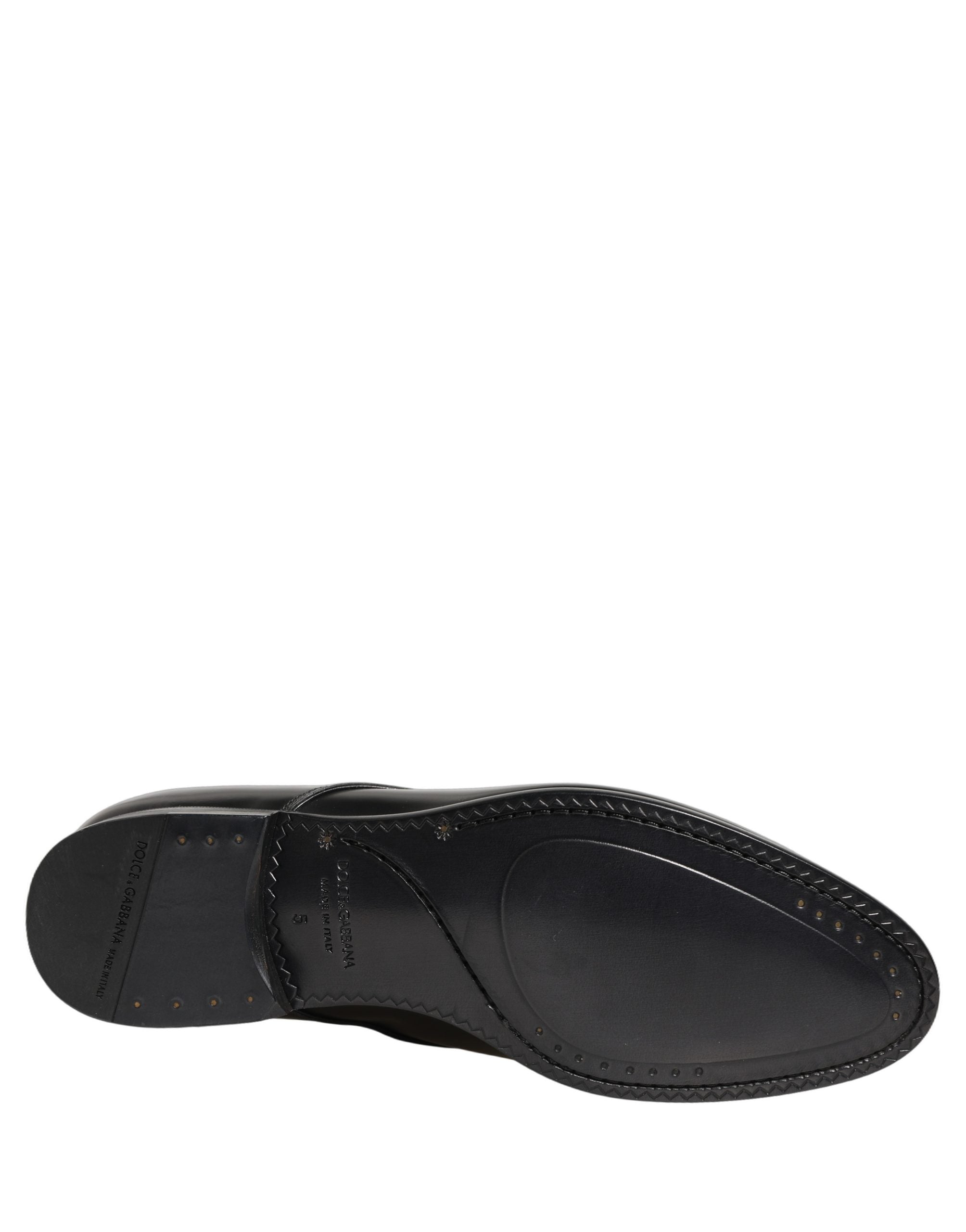 Chaussures derby Dolce & Gabbana en cuir noir, lacets, élégantes et sophistiquées pour homme, visibles en détail.