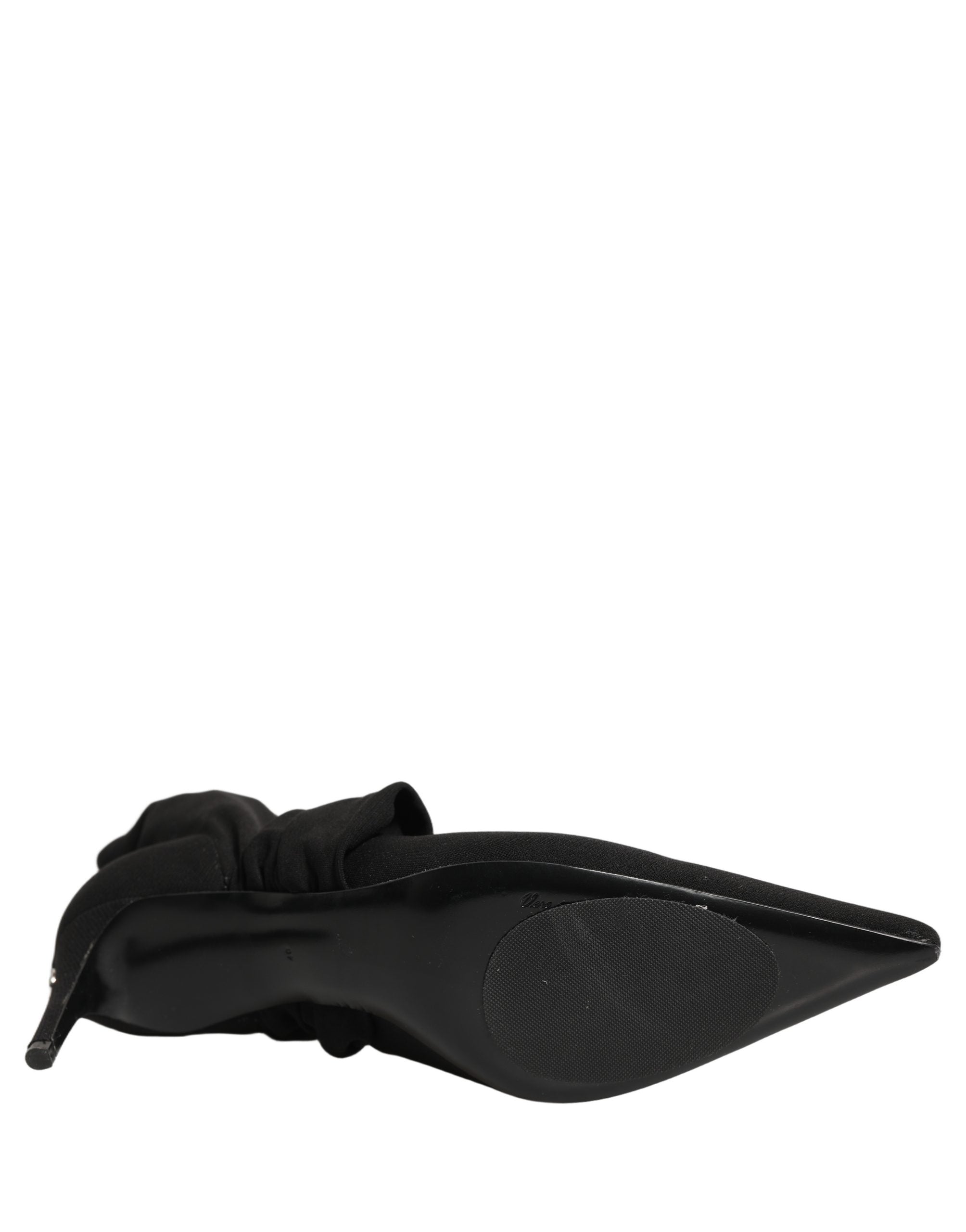 Chaussures Dolce & Gabbana à talons noirs, bottines en stretch et chaussettes montantes, visibles avec talons et semelle en cuir.