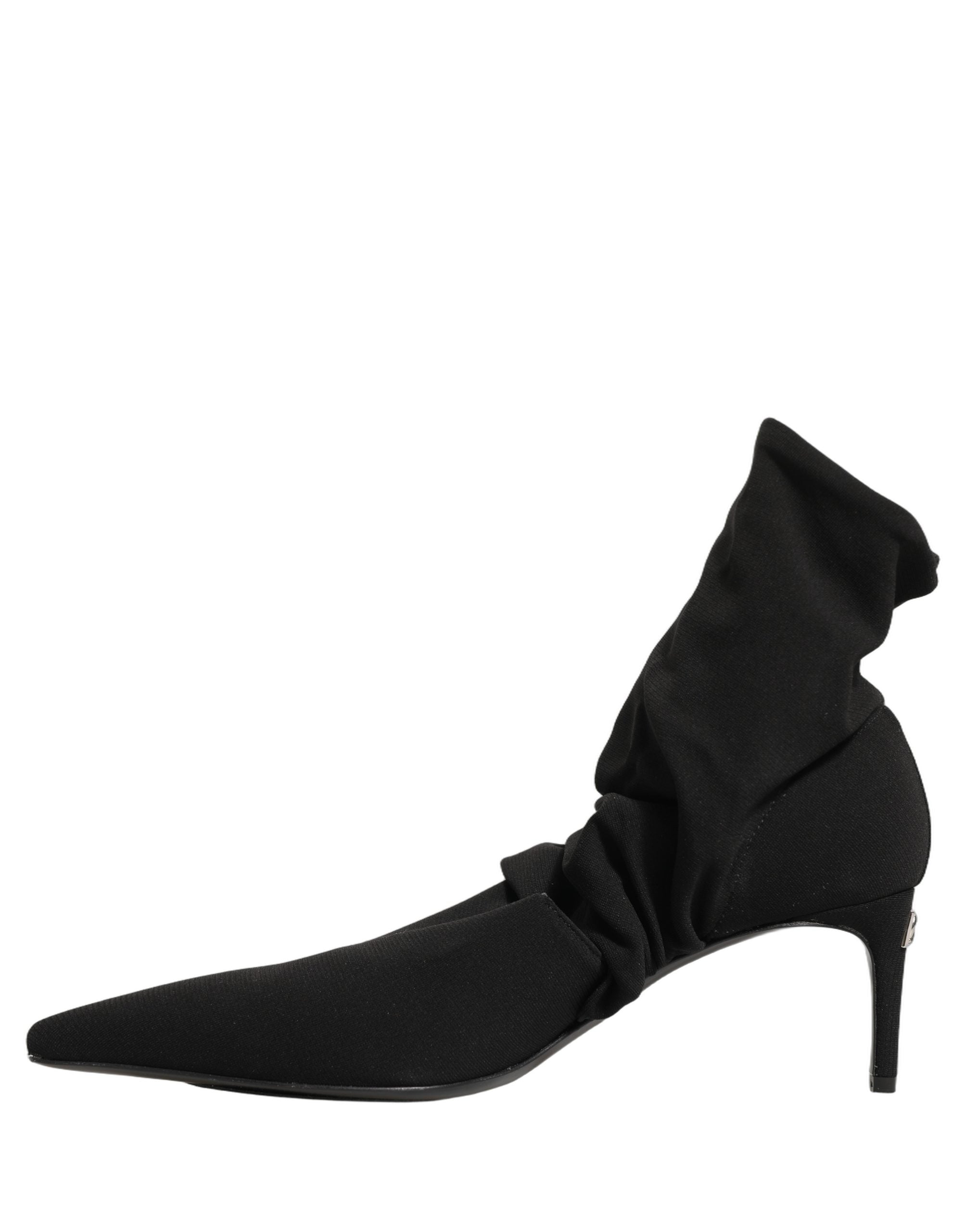 Chaussures Dolce & Gabbana, bottines à talons noires en cuir avec chaussettes extensibles, semelle en caoutchouc et talon élégant.