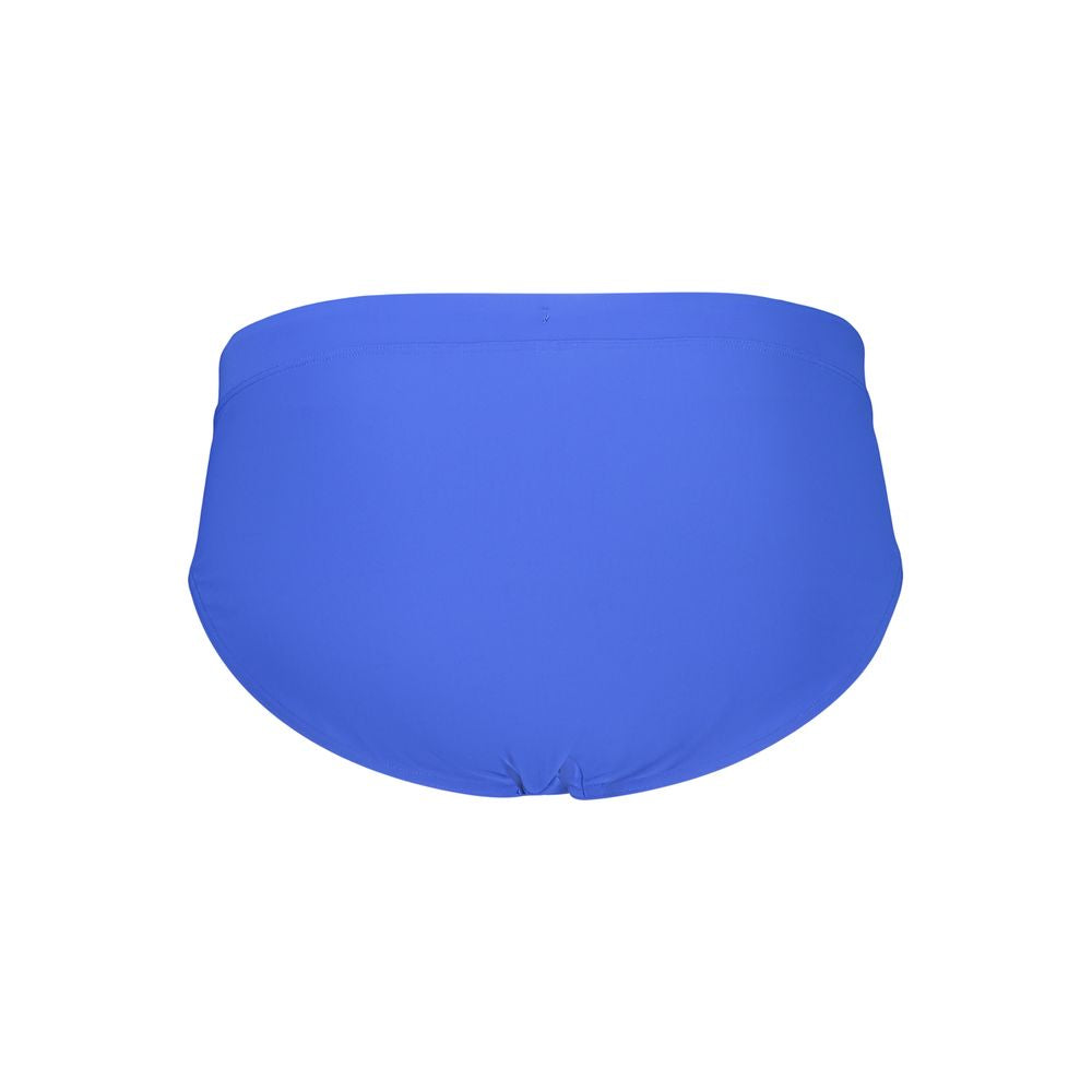 Maillot de bain homme Tommy Hilfiger en polyester bleu, avec logo distinctif, parfait pour la plage ou la piscine.