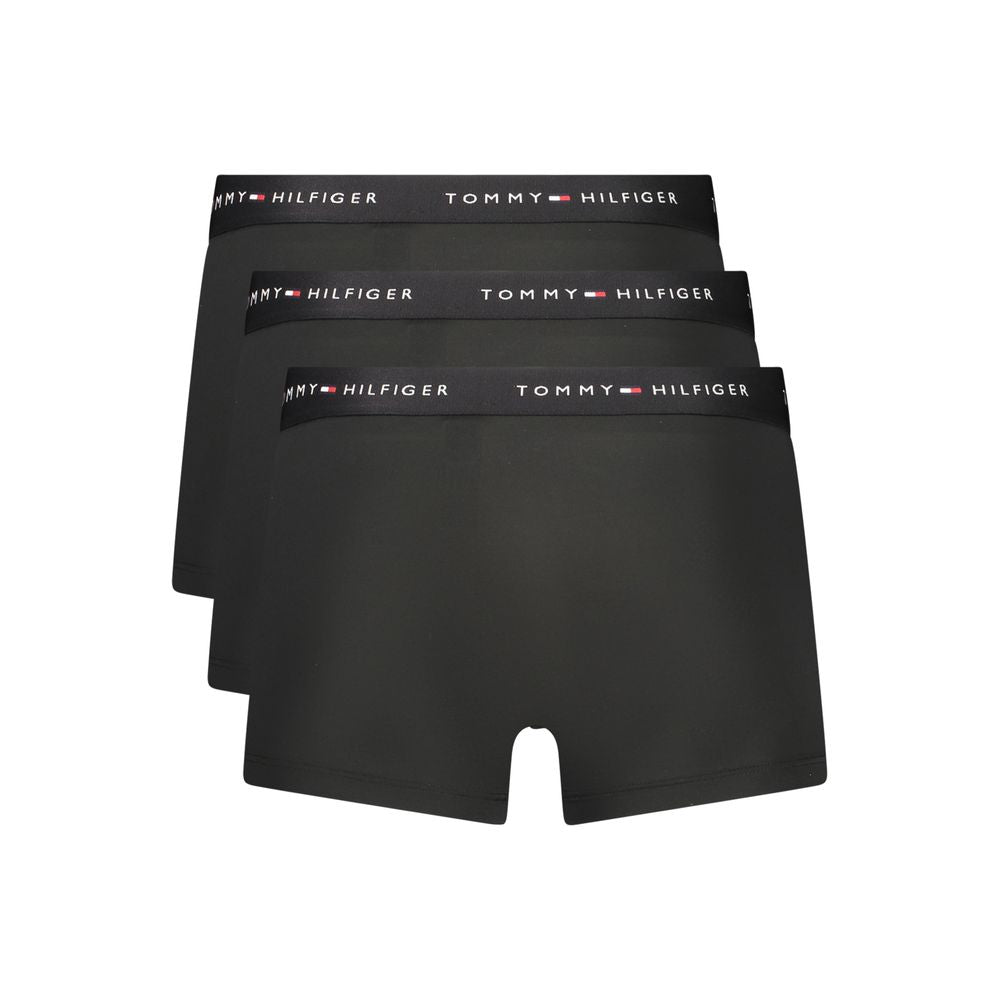 Boxers pour homme Tommy Hilfiger en polyester noir, coupe confortable et logo distinctif sur la ceinture.