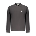 Sweatshirt pour homme Calvin Klein en coton noir, décontracté avec logo discret sur la poitrine, porté dans une ambiance décontractée.