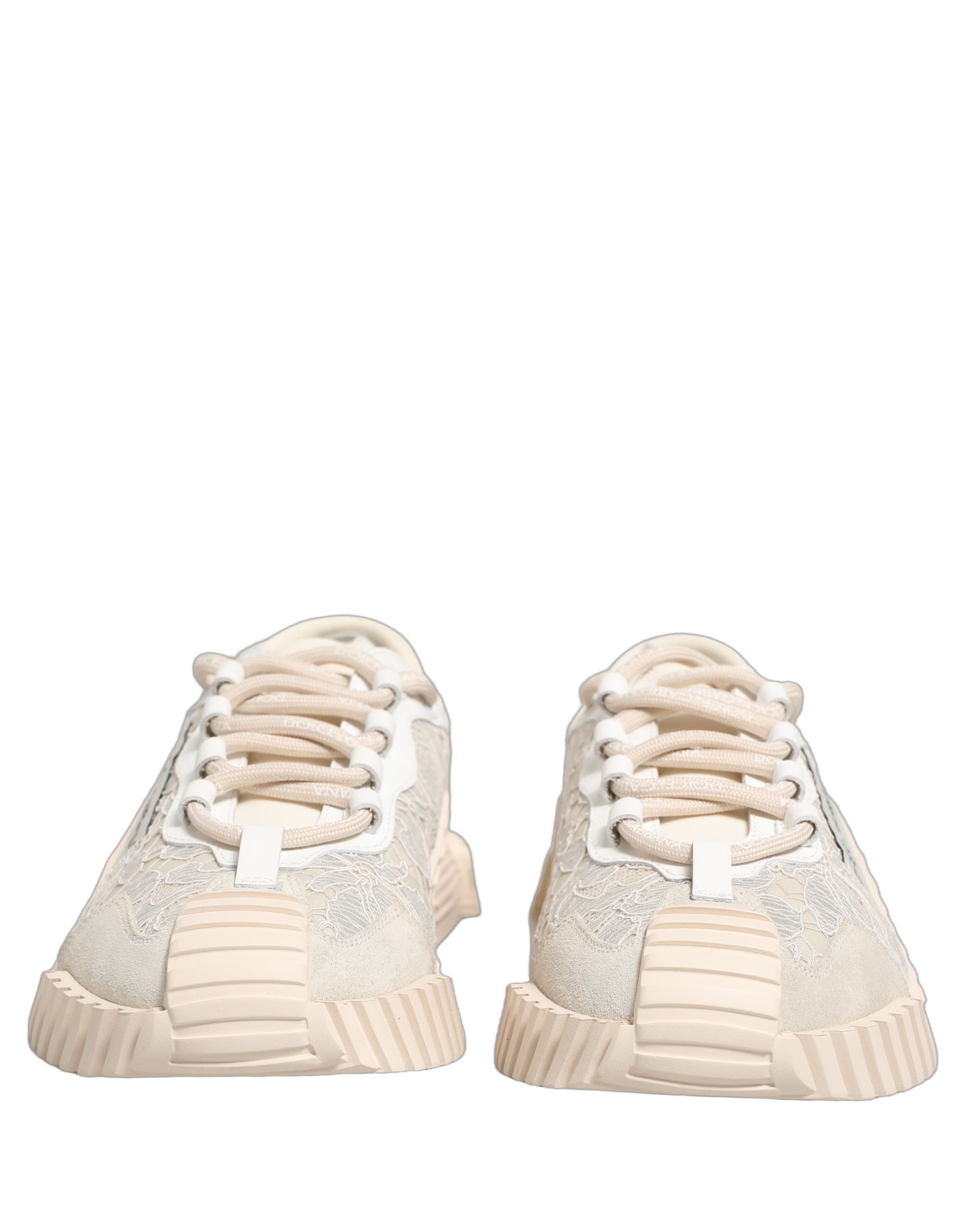 Chaussures de sport blanches Dolce & Gabbana NS1 Low Top en dentelle avec semelle plate, style élégant et sportif.