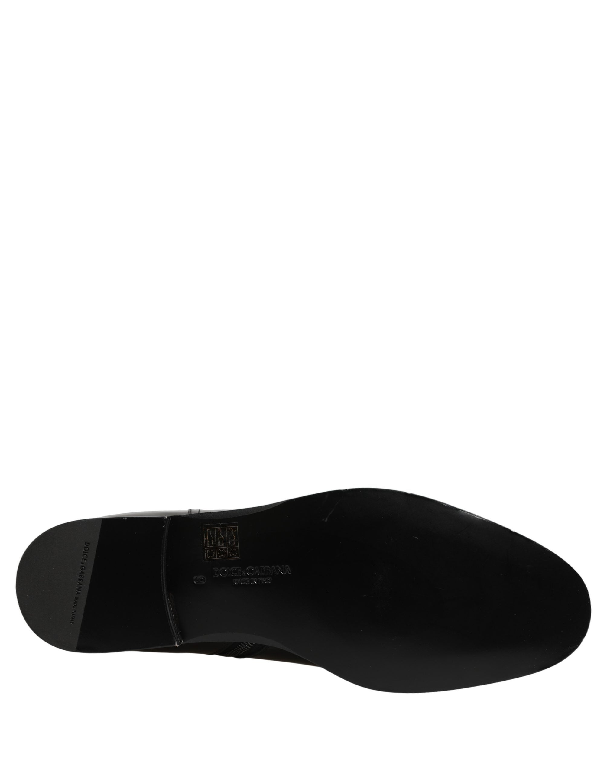 Bottes mi-mollet en cuir noir Dolce & Gabbana avec boucle logo, style élégant et sophistiqué pour femmes.