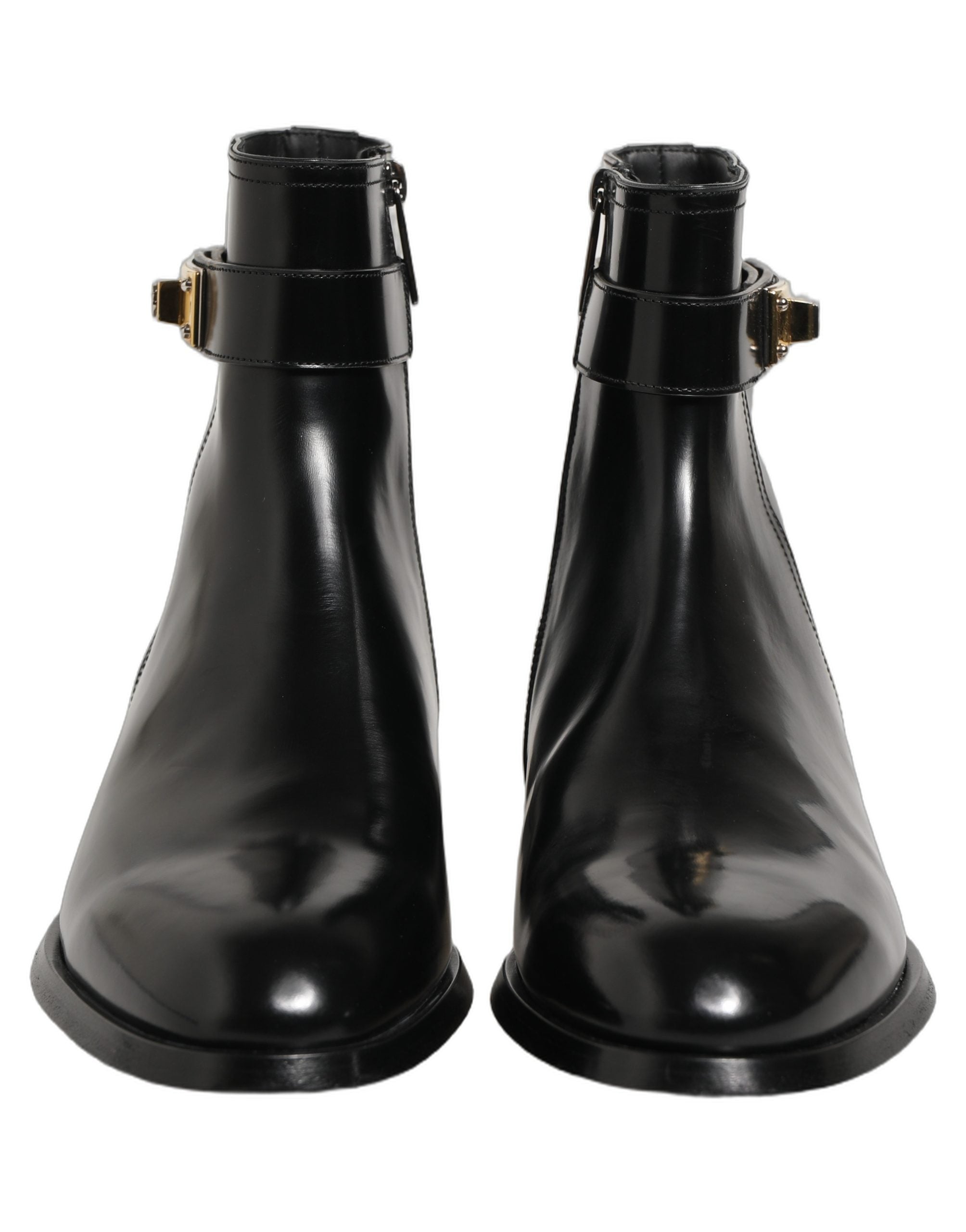 Bottes mi-mollet en cuir noir Dolce & Gabbana avec boucle logo, style élégant et sophistiqué pour femmes.