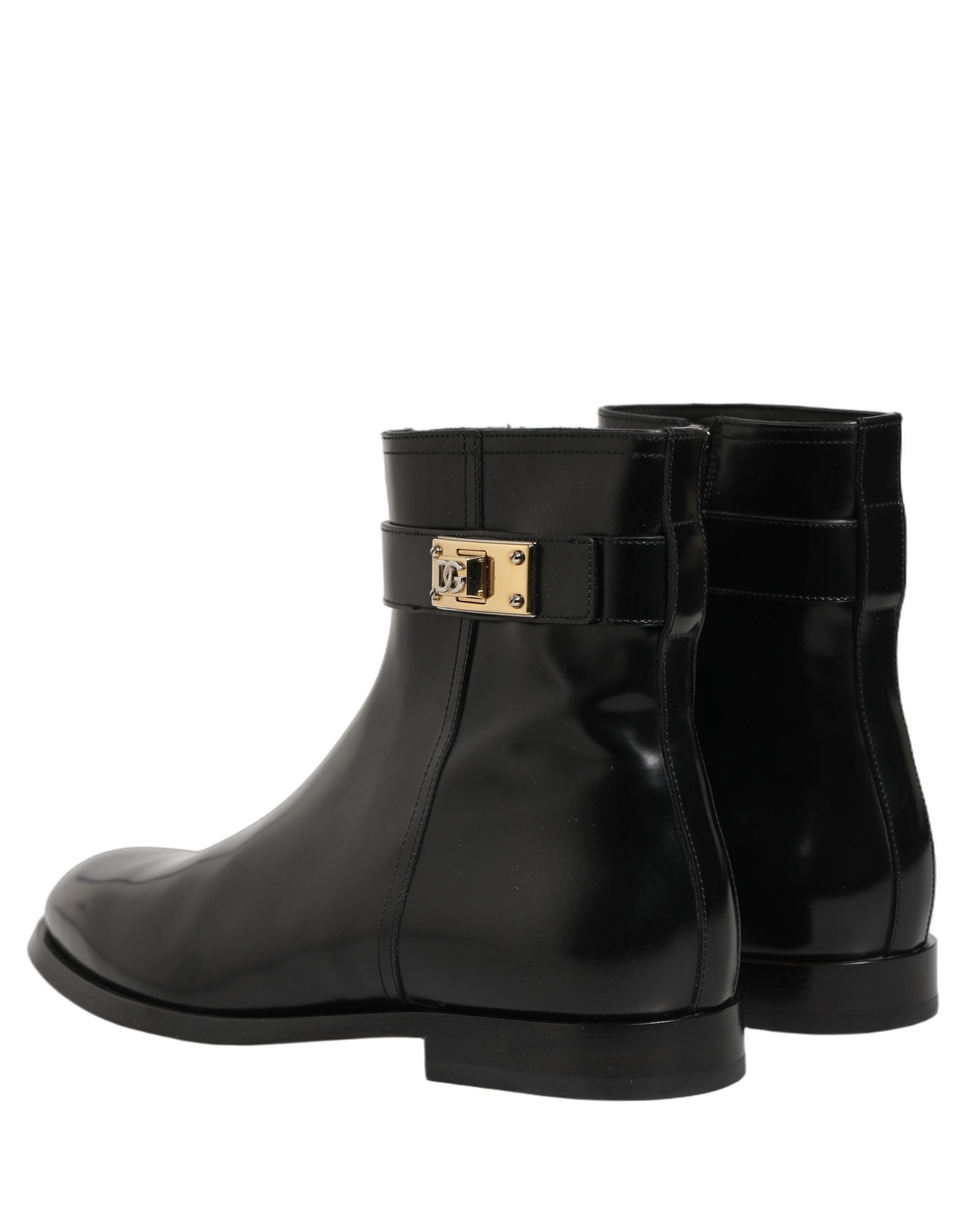 Bottes en cuir noir Dolce & Gabbana avec boucle logo et mi-mollet, élégantes et sophistiquées pour femmes.