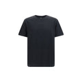 T-shirt noire en coton Balmain, coupe classique avec logo discret, porté sur mannequin.