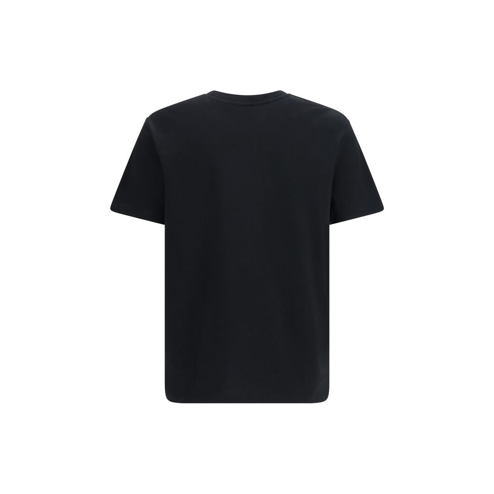 T-shirt en coton noir Balmain, coupe classique, logo discret sur la poitrine, porté sur un mannequin.