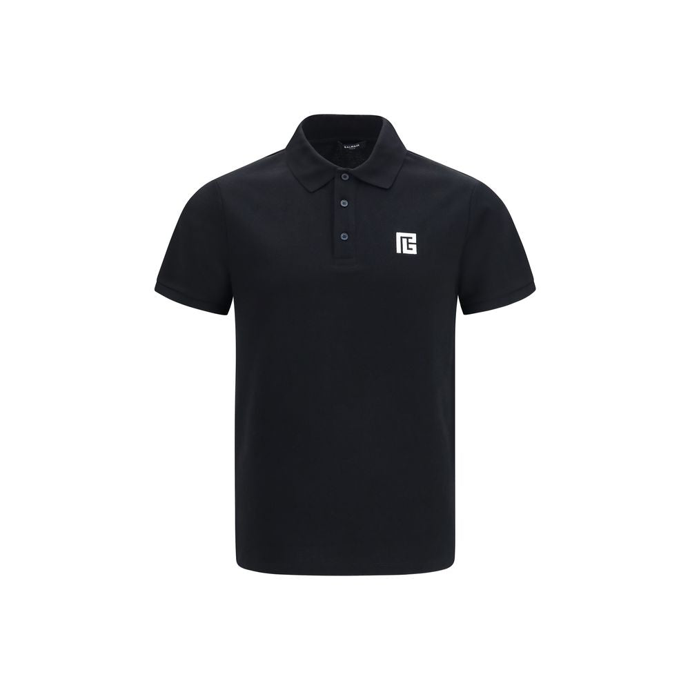 Chemise polo noire en coton de Balmain affichée, avec col classique et logo discret sur la poitrine.