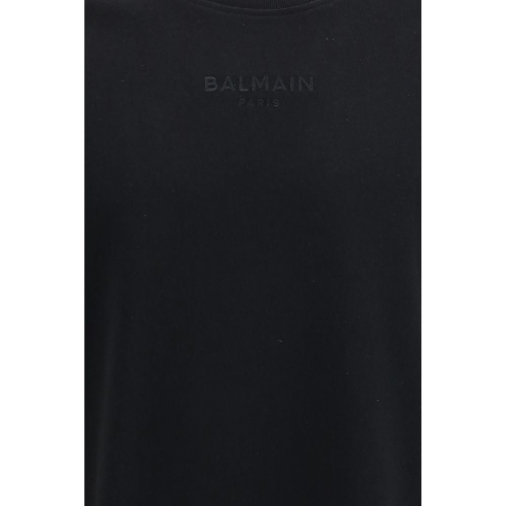 T-shirt noir en coton de la marque Balmain, coupe classique avec logo brodé visible sur le devant.