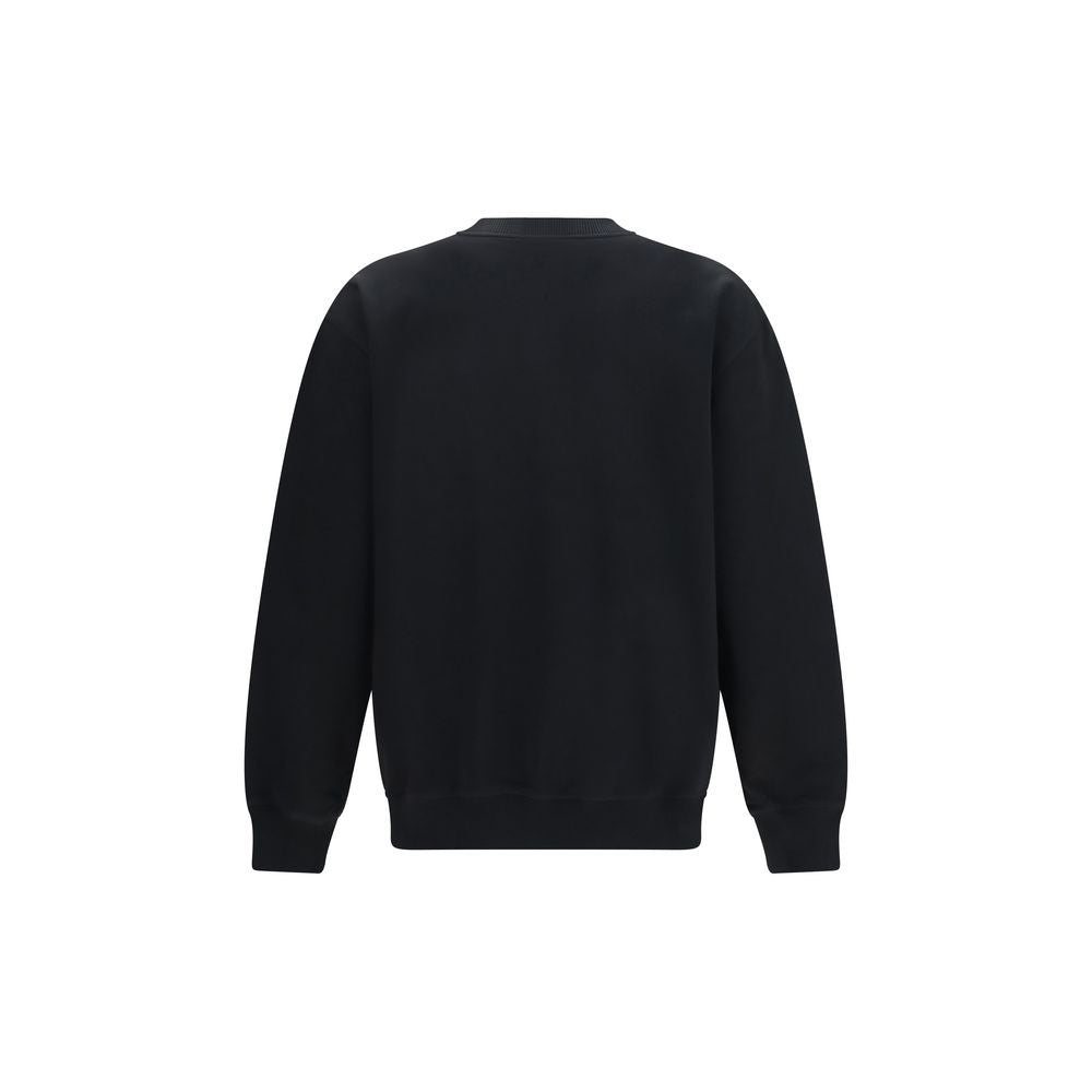 Sweatshirt en coton noir de la marque Balmain, coupe décontractée et détails tendance, vue de face.