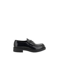 Chaussures Prada Bos Taurus en cuir de veau noir avec plateforme, mocassins élégants et confortables.