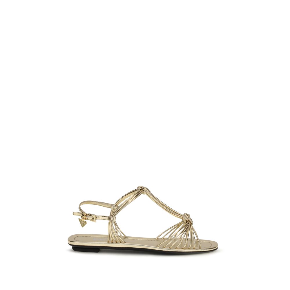 Sandales plates Prada Bos Taurus en cuir de veau doré, chaussures élégantes pour femme, vue en gros plan.