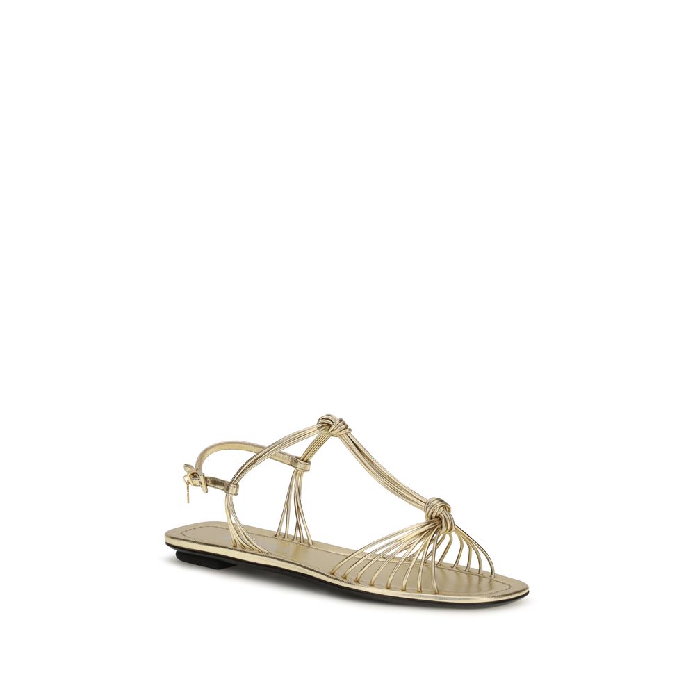 Sandales plates Prada Bos Taurus en cuir de veau doré, style élégant et confortable pour femme.