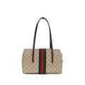 Sac à main Gucci en coton beige, avec détails élégants, parfait pour une touche sophistiquée.
