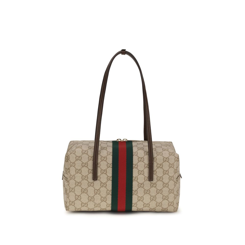 Sac à main Gucci en coton beige, avec détails élégants, parfait pour une touche sophistiquée.